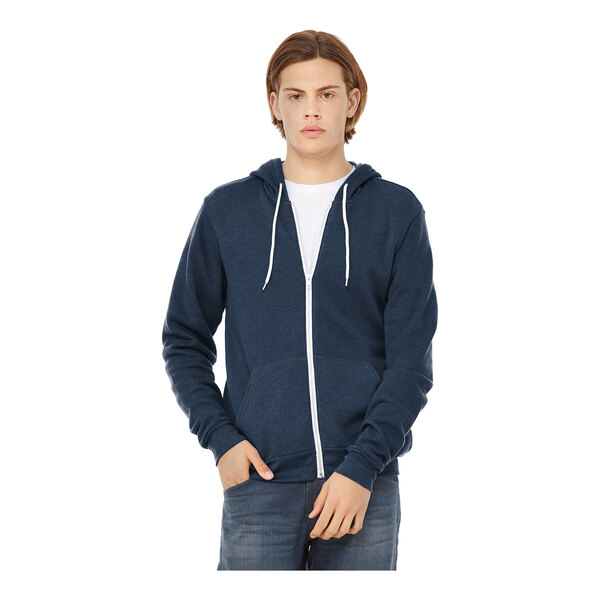 A man wearing a Bella + Canvas heather navy blue full-zip hoodie.