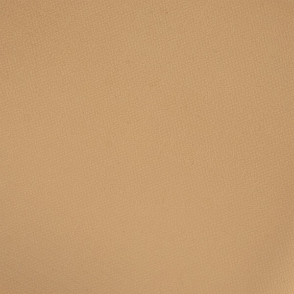 A close up of a tan surface with a fabric texture.