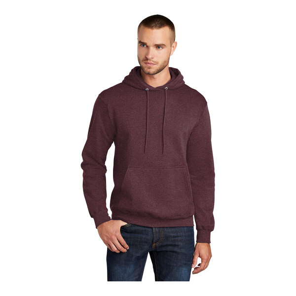 A man wearing a Port & Company heather athletic maroon core fleece pullover hoodie.