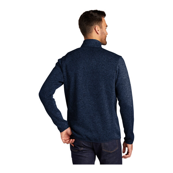 A person wearing a River Blue Port Authority fleece sweater jacket.