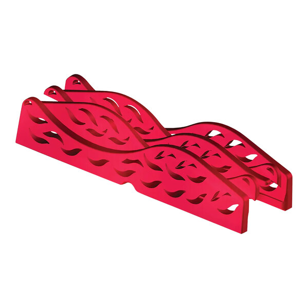 A red and white plastic leaf with carved designs.