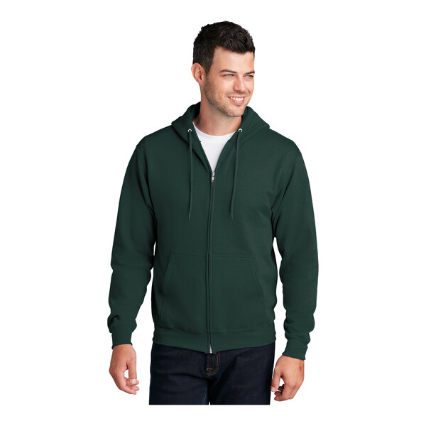 A man wearing a dark green Port & Company Core Fleece full-zip hoodie