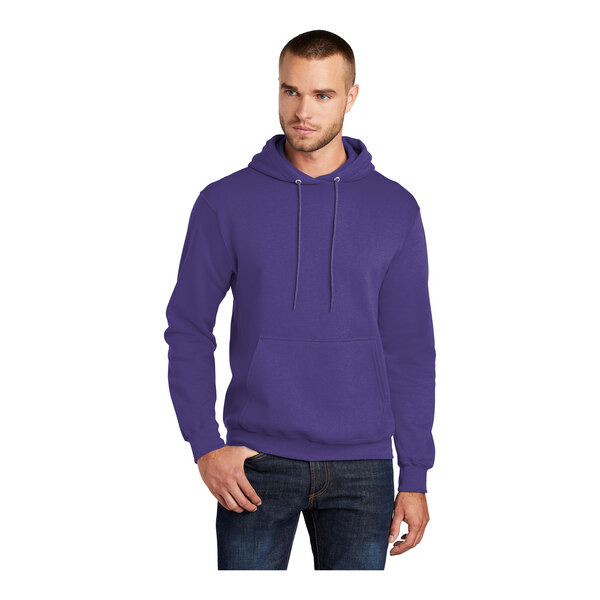 A man wearing a purple Port & Company Core Fleece pullover hoodie.