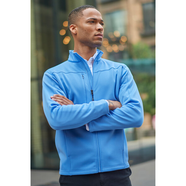 A man in a blue Edwards fleece jacket with a full-zip closure.
