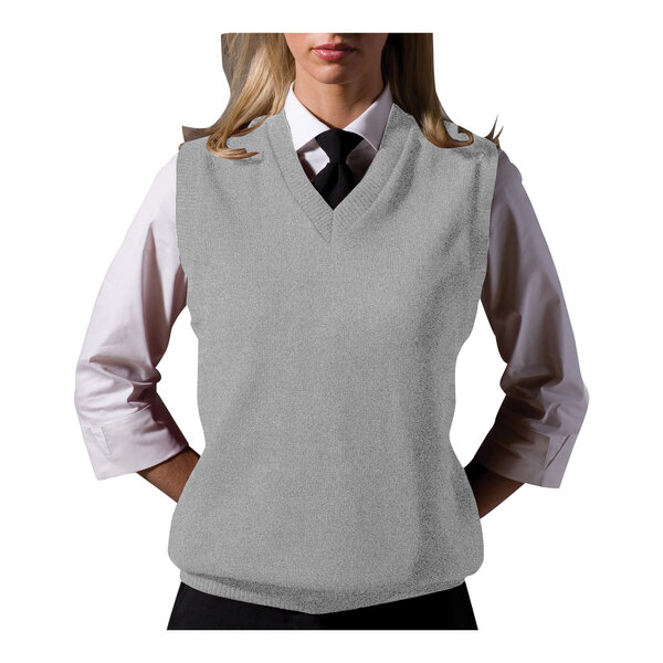 A woman wearing an Edwards gray jersey knit vest over a white shirt with a tie.