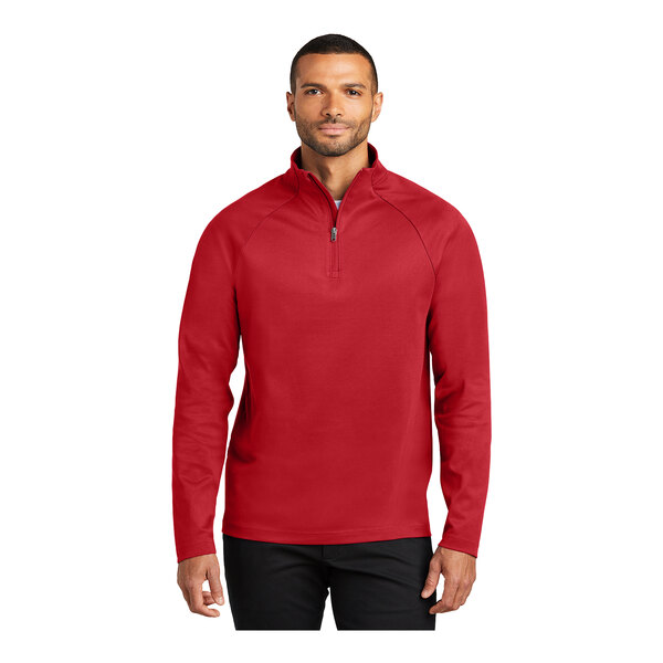 A man wearing a Port Authority rich red quarter-zip sweatshirt.