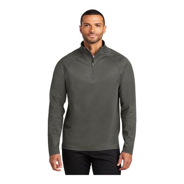 A man wearing a Port Authority gray steel quarter-zip sweatshirt.