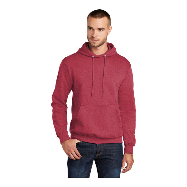 A man wearing a heather red Port & Company Core Fleece pullover hoodie.
