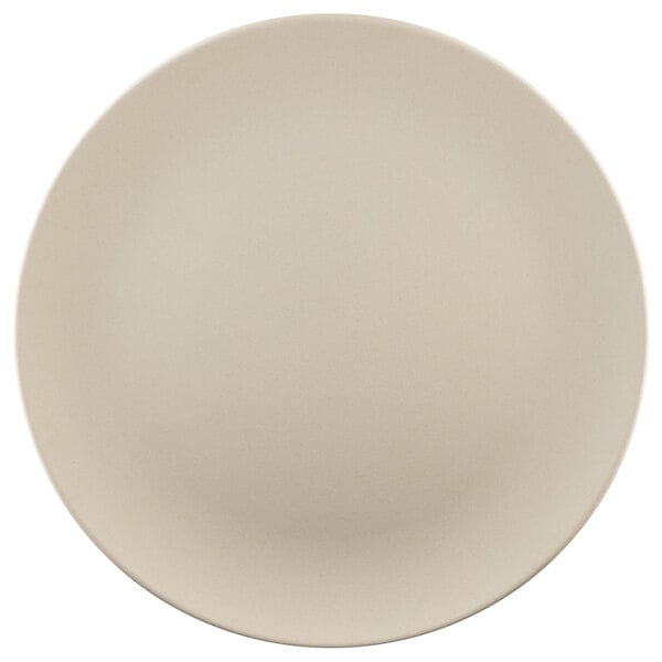 An Elite Global Solutions Papyrus-colored round melamine plate with a plain edge on a white surface.