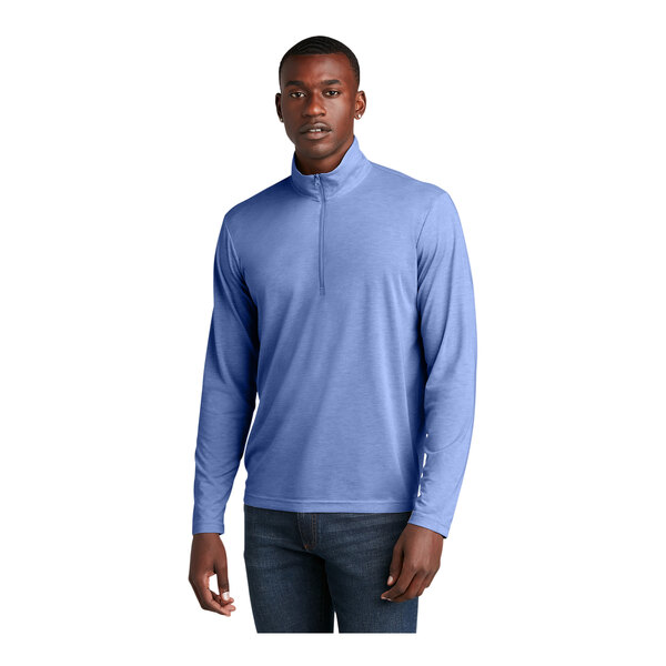 A man wearing a blue Sport-Tek PosiCharge quarter-zip pullover.