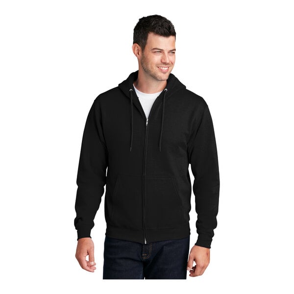 A man wearing a Port & Company black full-zip hoodie sweatshirt.