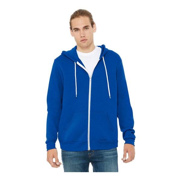 A man wearing a Bella + Canvas blue zip-up hoodie.