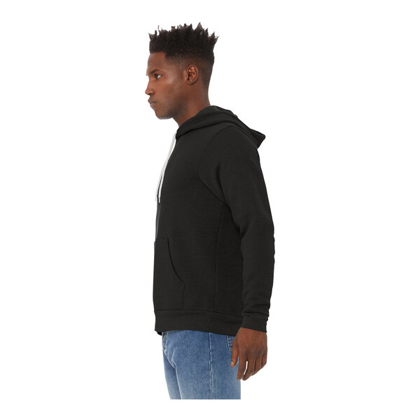 A man wearing a Bella + Canvas black sponge fleece pullover hoodie.