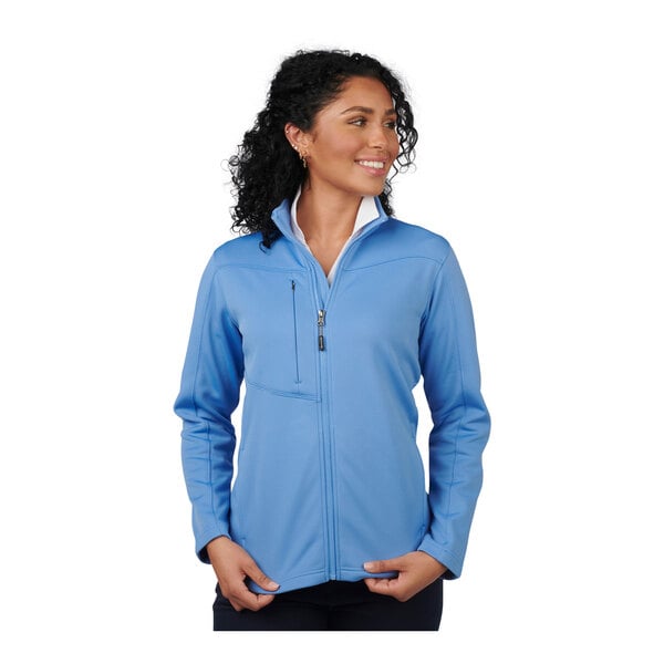 A woman wearing a light blue Edwards fleece jacket with white zippers.