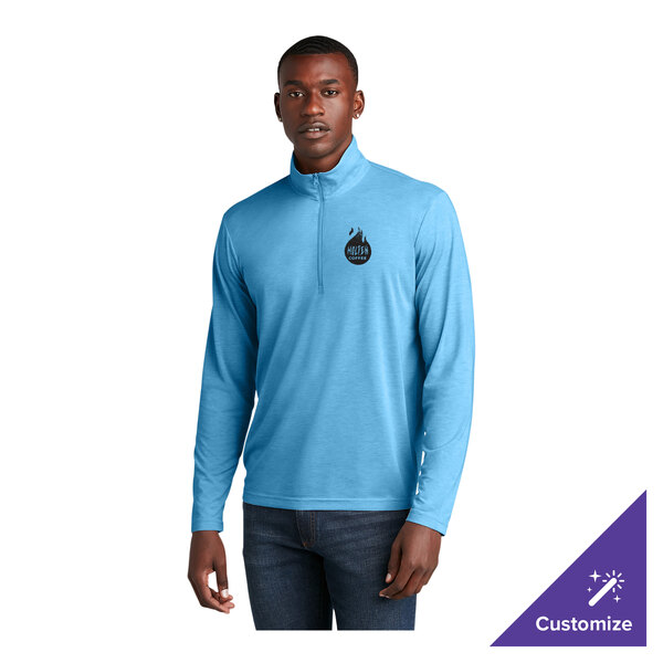 A light blue heather unisex quarter-zip pullover sweatshirt with a small chest logo, designed for moisture-wicking and customizable options.