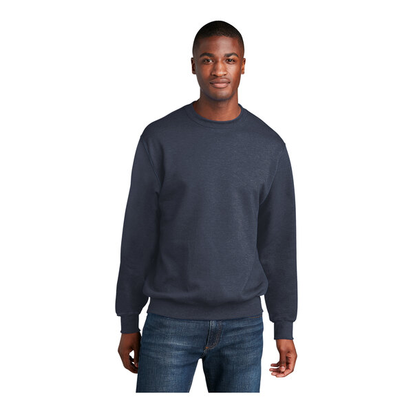 A man wearing a Port & Company heather navy fleece crew neck sweatshirt.