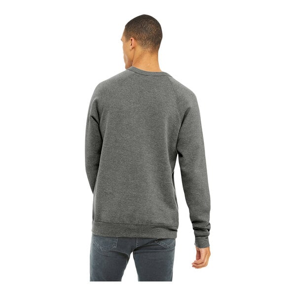 A man wearing a Bella + Canvas grey triblend raglan sweatshirt.
