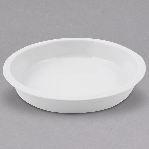 A white round ceramic food pan with a handle.