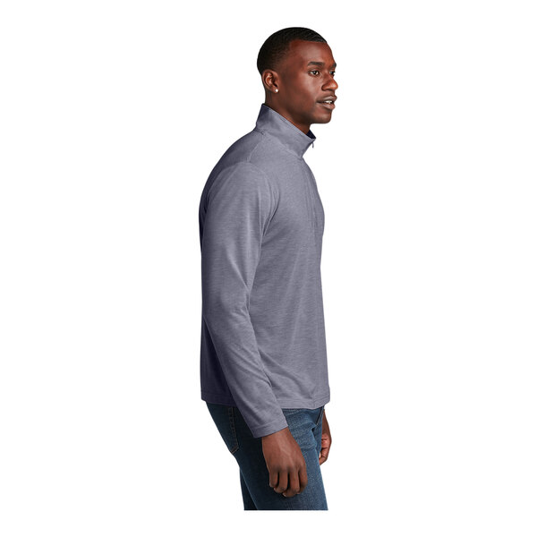 A man wearing a Sport-Tek True Navy Heather quarter-zip pullover.