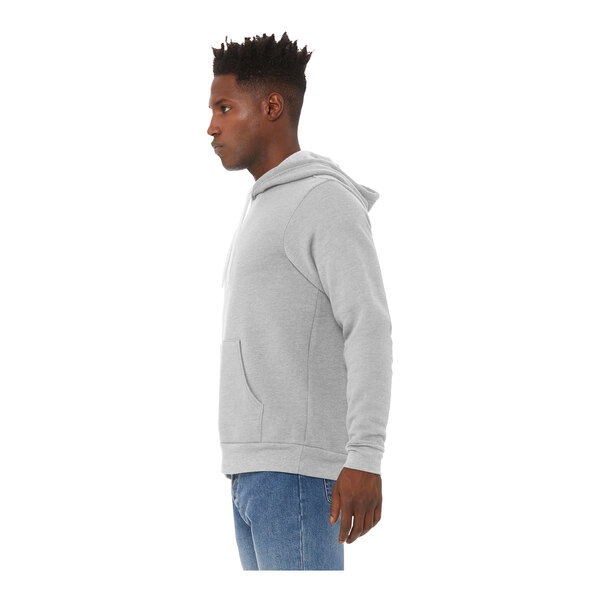 A man wearing a Bella + Canvas athletic heather grey pullover hoodie.