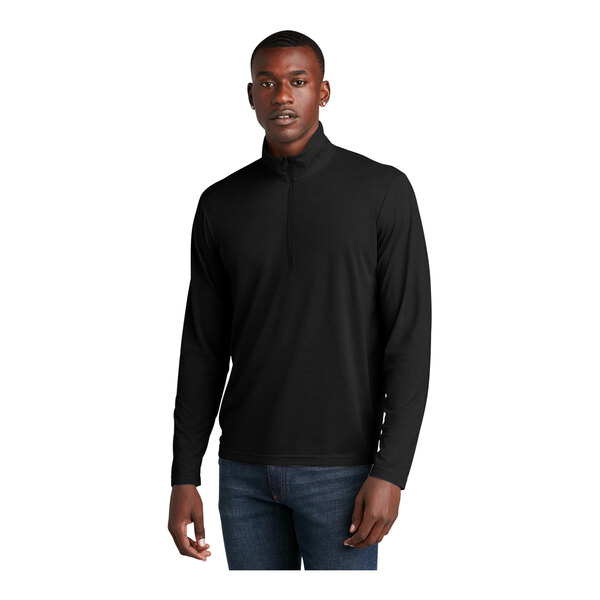 A man wearing a Sport-Tek black quarter-zip pullover.