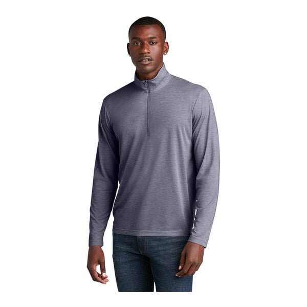 A man wearing a Sport-Tek True Navy Heather quarter-zip pullover with a grey shirt underneath.