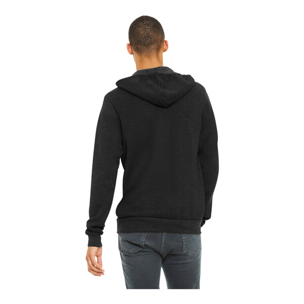 A person wearing a Bella + Canvas black sponge fleece full-zip hoodie.