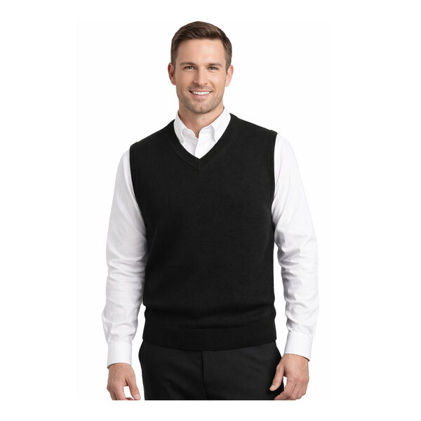 A black unisex jersey knit vest made of acrylic, shown worn over a white dress shirt.