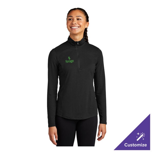 A women's black quarter-zip pullover sweatshirt with long sleeves and a small green 'forage' logo on the chest.