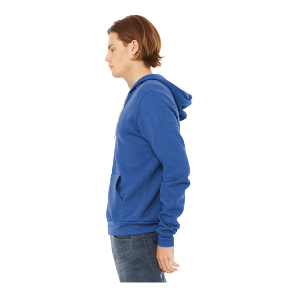 A man wearing a Bella + Canvas blue sponge fleece full-zip hoodie.