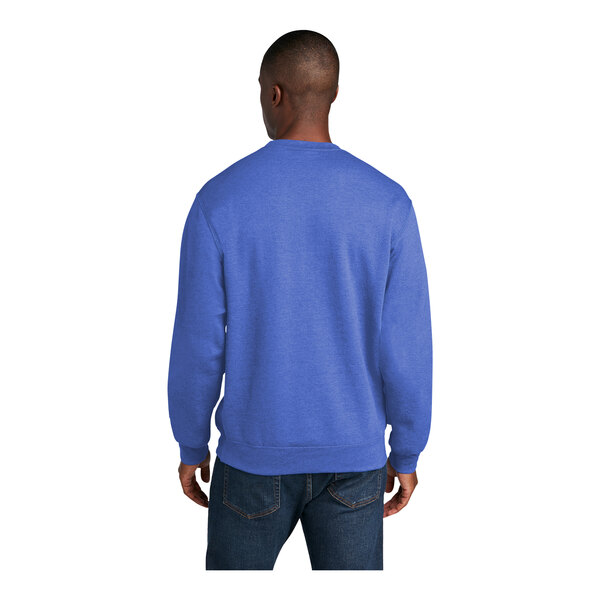 A man wearing a Port & Company heather royal blue core fleece sweatshirt.