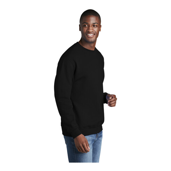 A man wearing a Port & Company black fleece sweatshirt.