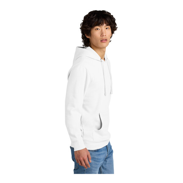 A man wearing a white District hoodie.