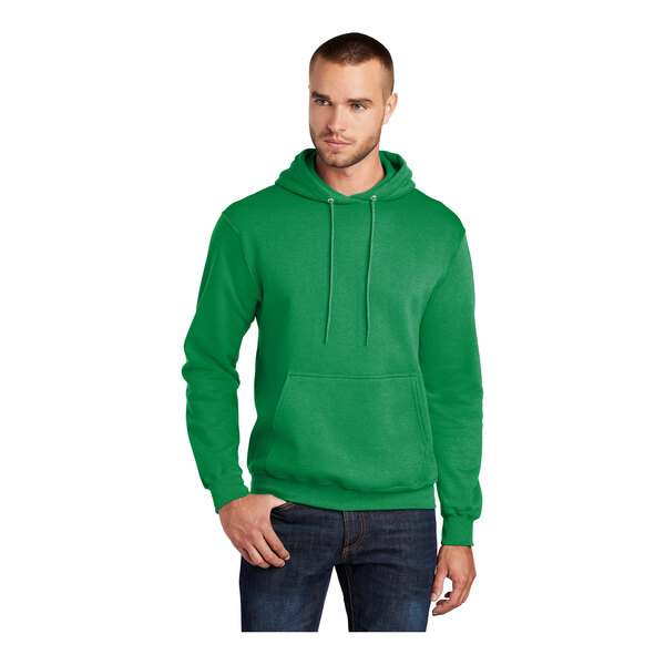 A man wearing a green Port & Company core fleece pullover hoodie.