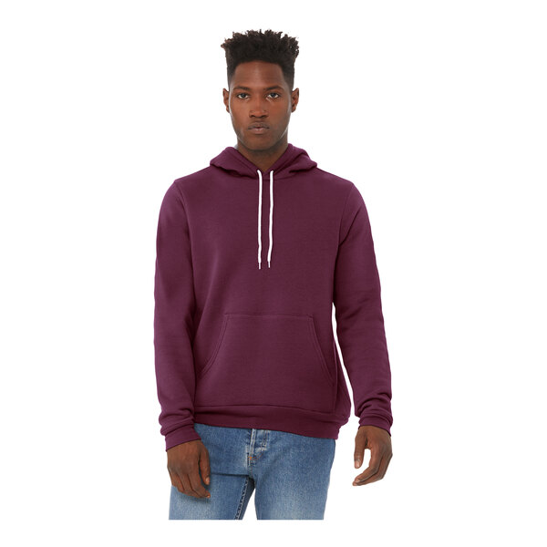 A man wearing a maroon Bella + Canvas sponge fleece pullover hoodie.