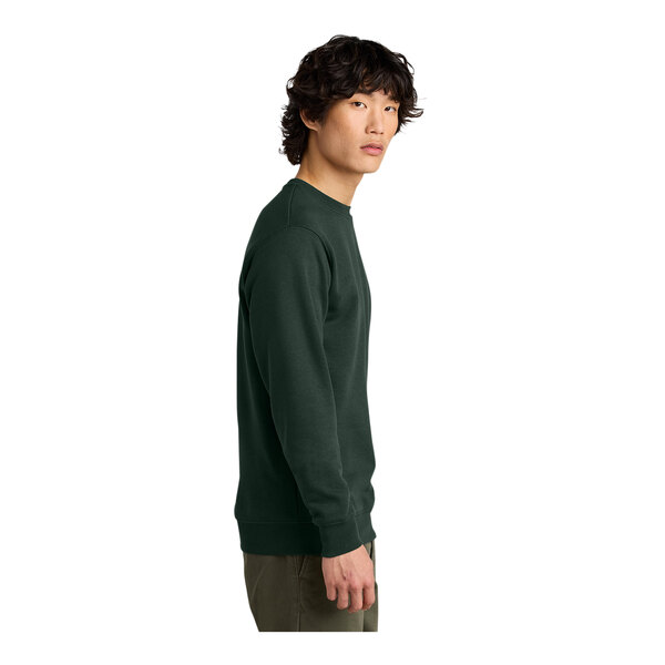 A man wearing a District forest green V.I.T. fleece sweatshirt.