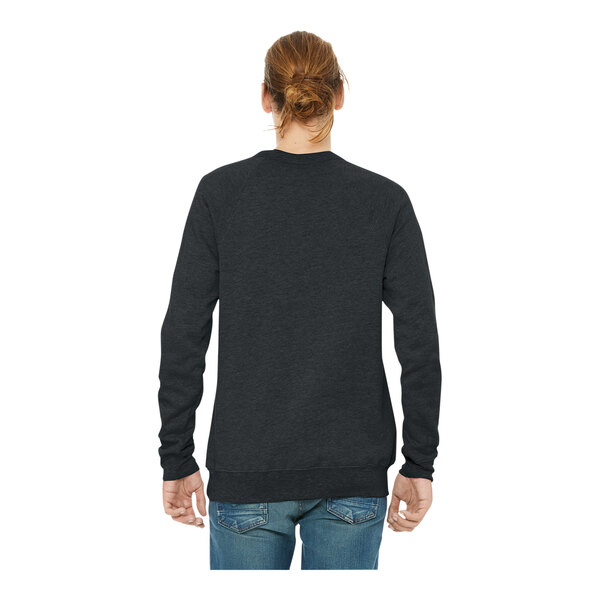 A man wearing a dark gray Bella + Canvas sponge fleece sweatshirt with black sleeves.