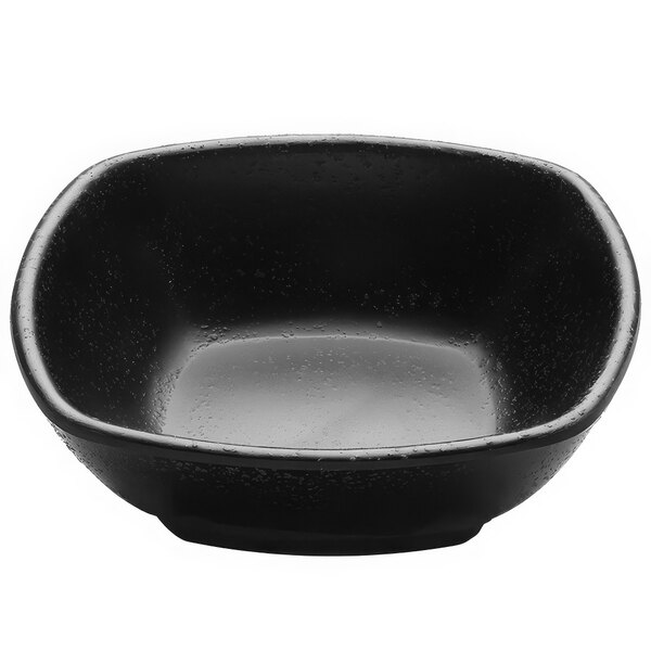 A black Elite Global Solutions Zen square bowl with water droplets on it.