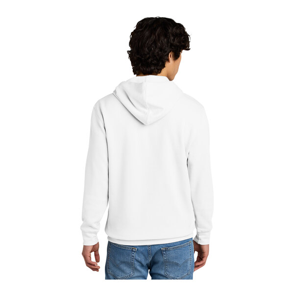 A man wearing a white District sweatshirt with a hood.