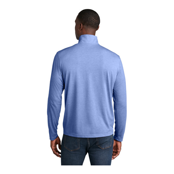 A man wearing a Sport-Tek True Royal Heather quarter-zip pullover over a long sleeved blue shirt.