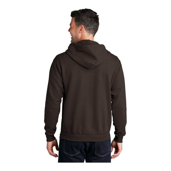 A man wearing a dark brown Port & Company full-zip hoodie.