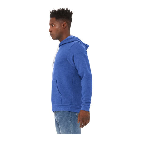 A man wearing a Bella + Canvas blue sponge fleece pullover hoodie.