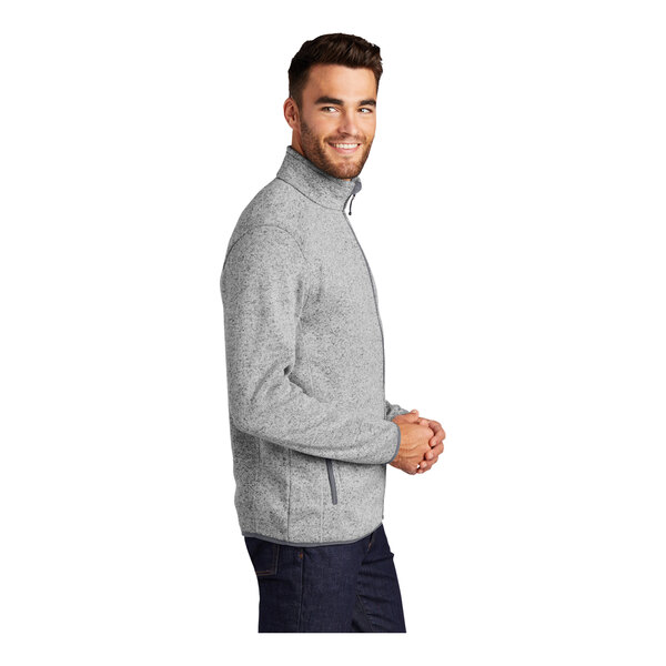 A man wearing a gray Port Authority fleece sweater jacket with a full-zip.