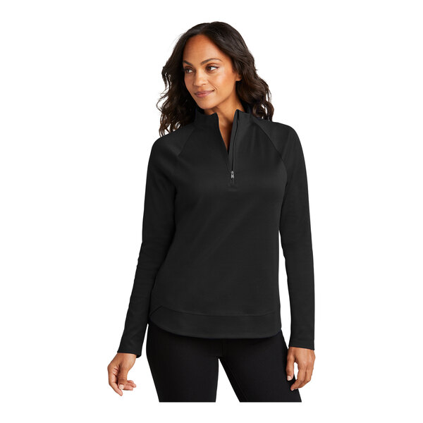 A woman wearing a Port Authority black C-FREE Cypress quarter-zip sweatshirt.