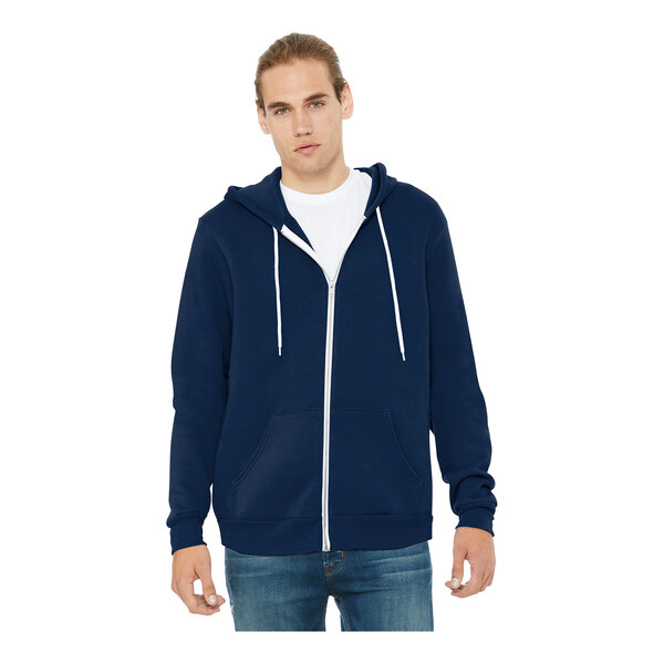 A man wearing a navy Bella + Canvas zip hoodie.
