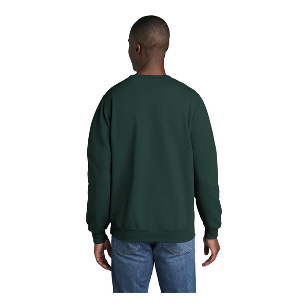 A man wearing a dark green Port & Company fleece sweatshirt.