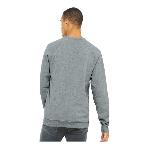 A man wearing a Bella + Canvas grey sponge fleece sweatshirt with raglan sleeves.