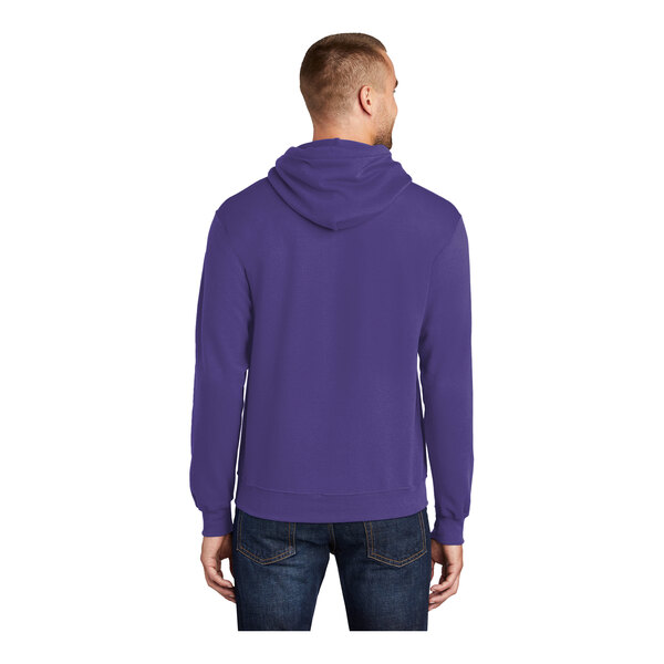 A man wearing a purple Port & Company Core Fleece pullover hoodie.