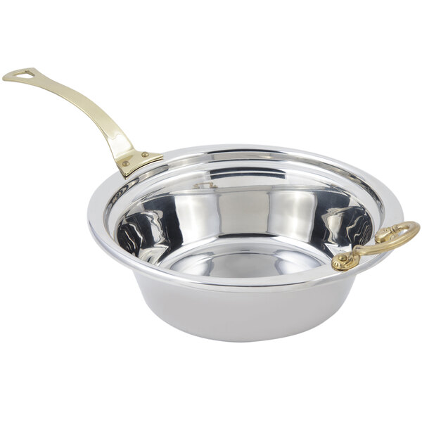 A stainless steel Bon Chef casserole food pan with long brass handles.