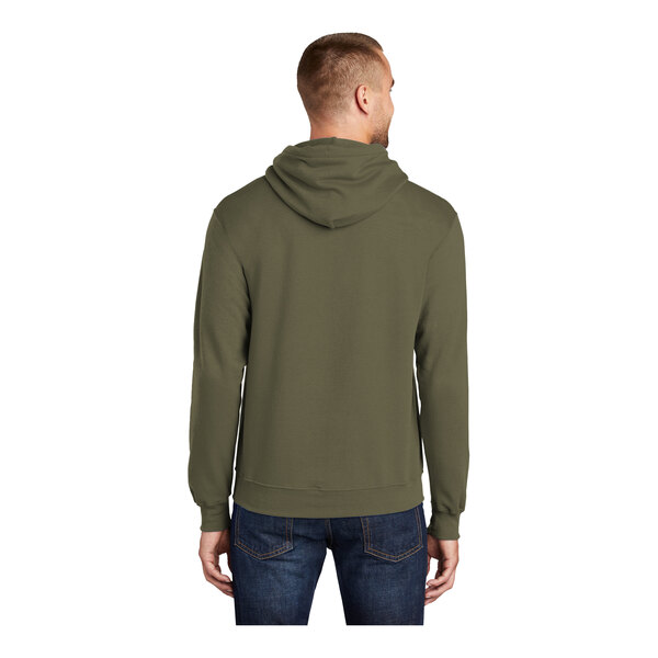 A man wearing an olive drab green Port & Company Core Fleece pullover hoodie.
